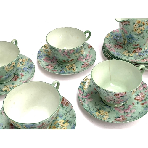 186 - A Shelley 'Melody' tea set, comprising six teacups, saucers and cake plates, sandwich plate, butter ... 