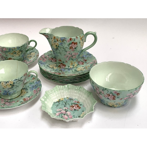 186 - A Shelley 'Melody' tea set, comprising six teacups, saucers and cake plates, sandwich plate, butter ... 