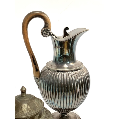 311 - A mixed box of items to include silver plated teapot, claret jug, pewter tankard, copper items, an E... 