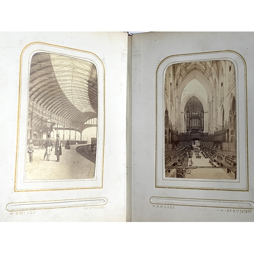 266 - A small photograph album containing a quantity of late 19th and early 20th century postcards, drawin... 