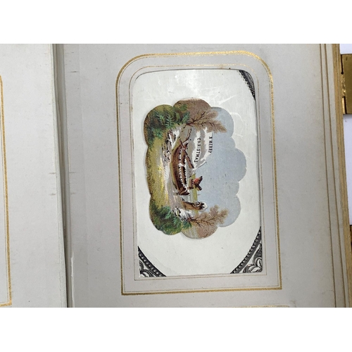 266 - A small photograph album containing a quantity of late 19th and early 20th century postcards, drawin... 