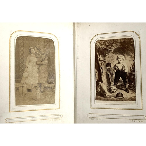 266 - A small photograph album containing a quantity of late 19th and early 20th century postcards, drawin... 