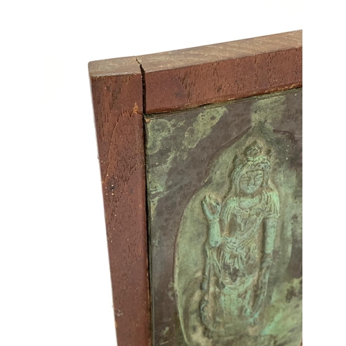 273 - A pair of wooden bookends with inset bronze panels, 25cmH