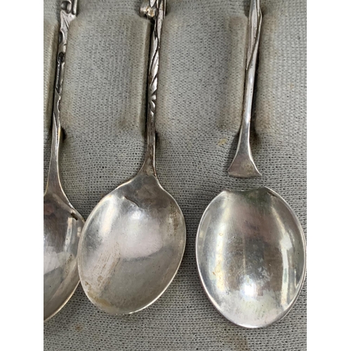 103 - A cased set of 12 Dutch silver coffee spoons, with flower terminals, one af, retailed by G. Schoorl