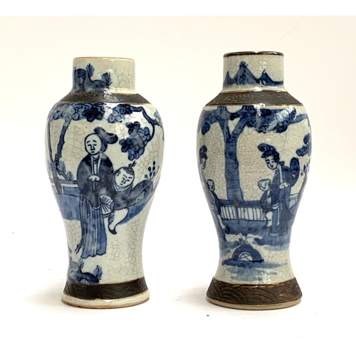 192 - Two Chinese blue and white crackle glazed vases of baluster form, incised marks to base, each approx... 