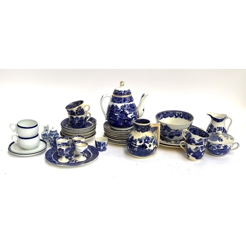 194 - A quantity of blue and white ceramics, mainly Willow pattern part tea service, including teapot with... 