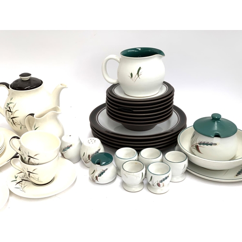 198 - A quantity of Royal Doulton 'Bamboo'; Denby 'Greenwheat' and Poole pottery dinner wares