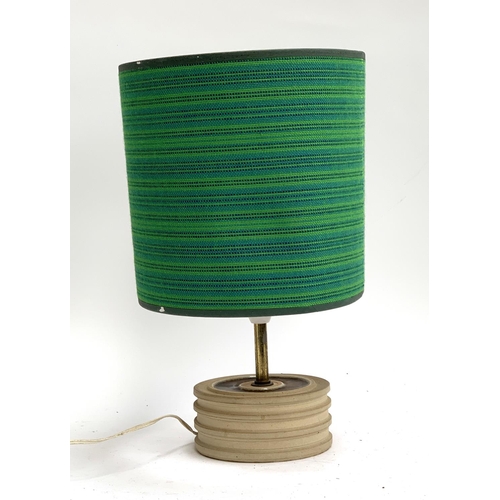 200 - A studio pottery table lamp, with blue and green fabric shade, 37cmH