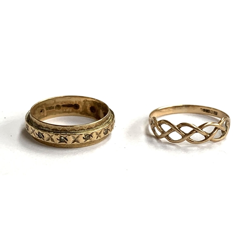 56 - A 9ct gold Celtic knot style ring, size M, together with a 9ct gold eternity ring set with white sto... 