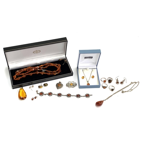 60 - A quantity of amber and amber type jewellery, to include silver rings, stud earrings silver heart sh... 