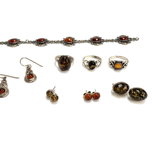 60 - A quantity of amber and amber type jewellery, to include silver rings, stud earrings silver heart sh... 