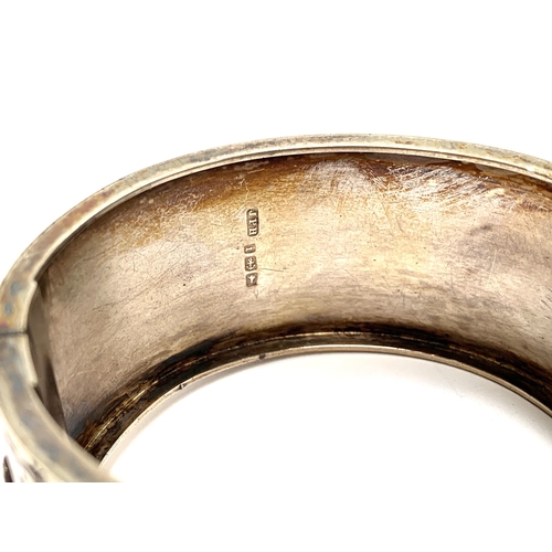 61 - A Victorian Aesthetic movement silver bangle, hallmarked for John Price Hunt, Birmingham 1883; toget... 