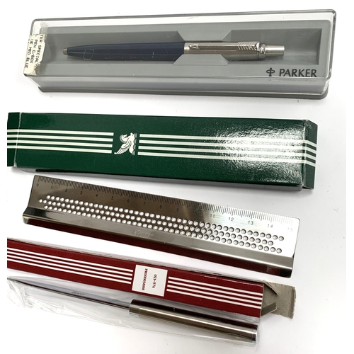 374 - A boxed Parker Sonnet ballpoint pen; together with a further Parker pen, a Cyrea ruler and letter op... 