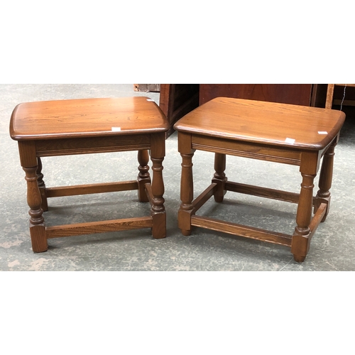 690 - A pair of Ercol elm occasional tables, each 46x37x38cmH; together with an elm Ercol magazine rack, 5... 