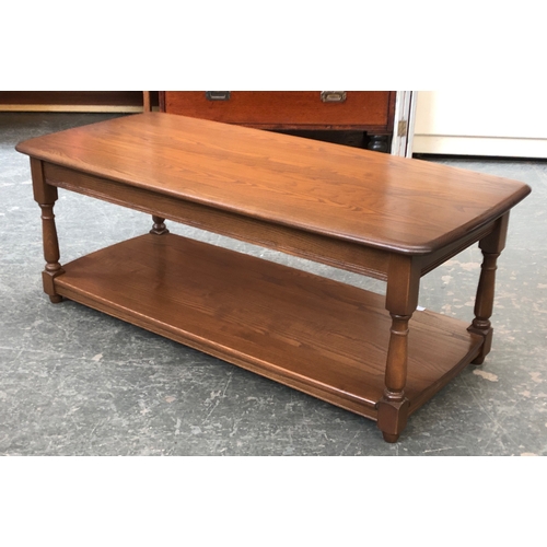 691 - An Ercol elm coffee table with undershelf, 115x55x44cmH