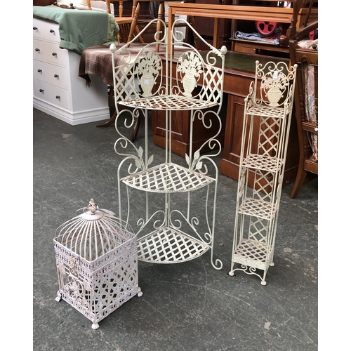 705 - Two white painted wrought metal plant stands, 110cmH and 95cmH; and a similar bird cage