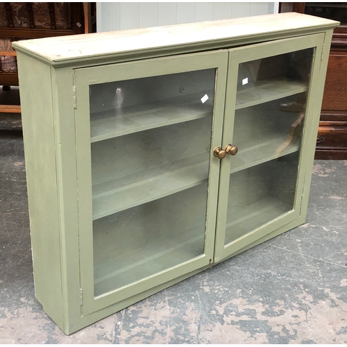 708 - A set of sage green painted glazed shelves, 109cmW