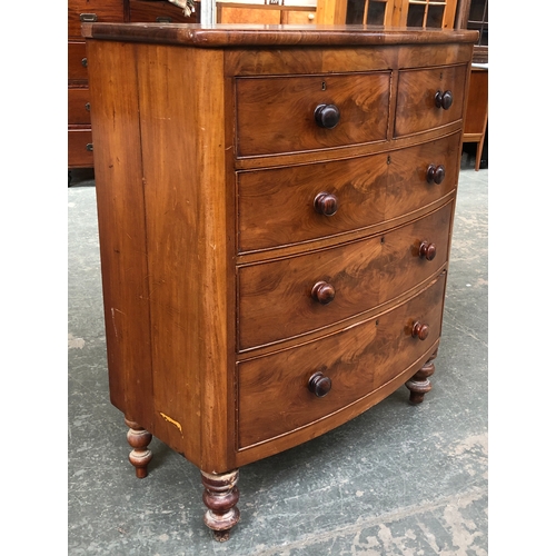 713 - A bowfront mahogany chest of two short over three long drawers (af), 110cmW