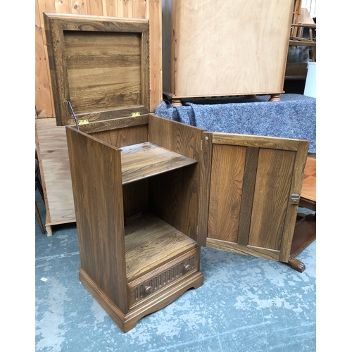 724 - An Ercol elm cabinet, panelled door with drawer below, 56x49x96cmH