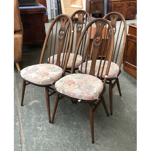 728 - A set of four Ercol elm hoopback kitchen chairs with swan splats