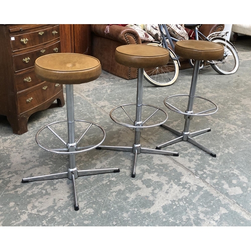 666 - Three vinyl and chrome bar stools, 67cmH