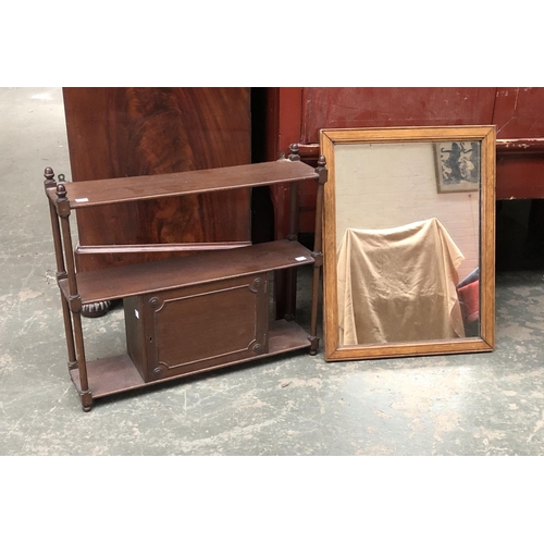 751 - A rectangular oak framed wall mirror, together with a small set of mahogany wall shelves