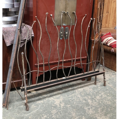 762 - An unusual wrought iron double bed frame, the headboard 164cmW 141cmH, the foot 85cmH