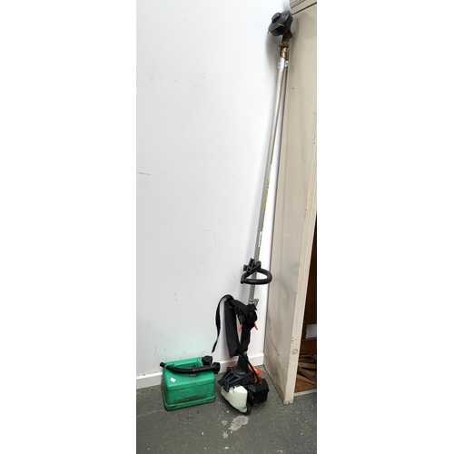 764 - A Tanaka petrol strimmer, with accessories and petrol can (empty)