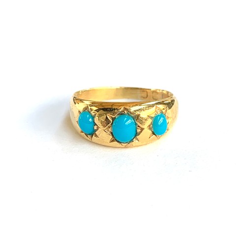 66 - A late 19th/early 20th century gold gypsy ring set with turquoise coloured cabochons, marks rubbed b... 