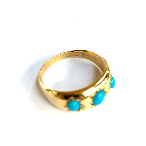 66 - A late 19th/early 20th century gold gypsy ring set with turquoise coloured cabochons, marks rubbed b... 