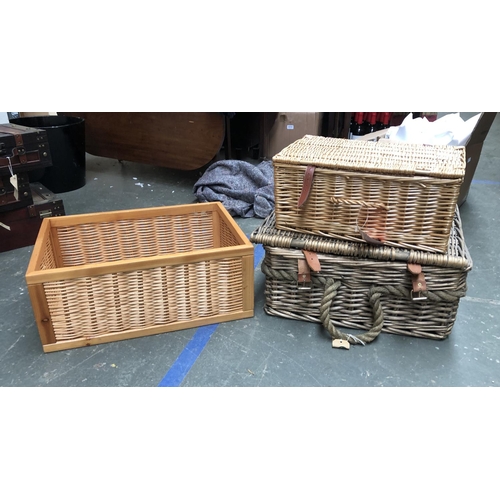 803 - Two wicker picnic hampers, the the larger 53x42x25cm; together with a further storage basket (3)