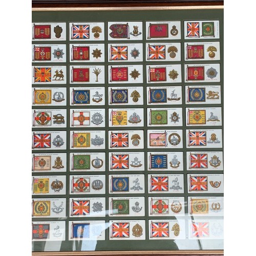 509 - A quantity of framed and glazed Player's cigarette cards to include cricket, butterflies, planes, et... 