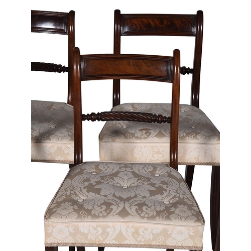 443 - A set of eight Regency mahogany dining chairs, two of the chairs with arms, all upholstered with but... 