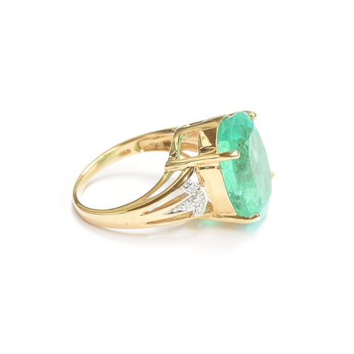 38 - An impressive 18ct gold ring set with a large Muzo Colombian emerald, the oval cut emerald 17x12mm a... 