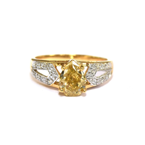 57 - An 18ct gold ring set with a large pear shaped Argyle fancy yellow diamond, the yellow diamond measu... 