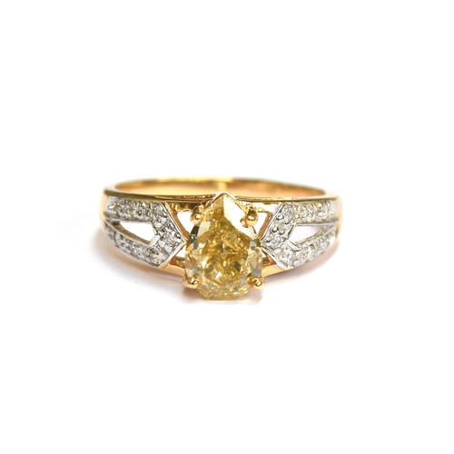 57 - An 18ct gold ring set with a large pear shaped Argyle fancy yellow diamond, the yellow diamond measu... 