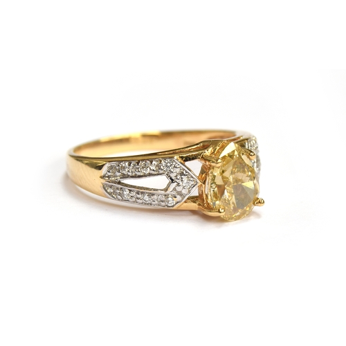 57 - An 18ct gold ring set with a large pear shaped Argyle fancy yellow diamond, the yellow diamond measu... 