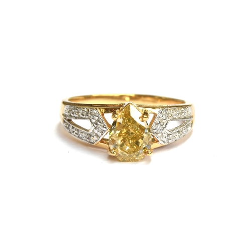 57 - An 18ct gold ring set with a large pear shaped Argyle fancy yellow diamond, the yellow diamond measu... 