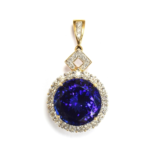 36 - An 18ct gold mounted large tanzanite pendant, the round brilliant cut stone measuring 16.5mmD and we... 