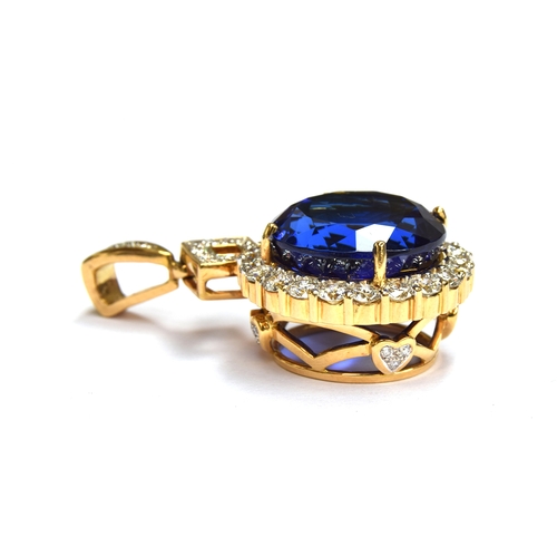 36 - An 18ct gold mounted large tanzanite pendant, the round brilliant cut stone measuring 16.5mmD and we... 