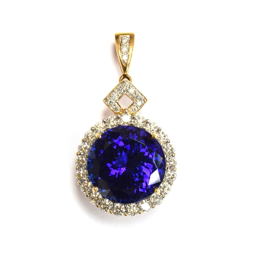 36 - An 18ct gold mounted large tanzanite pendant, the round brilliant cut stone measuring 16.5mmD and we... 