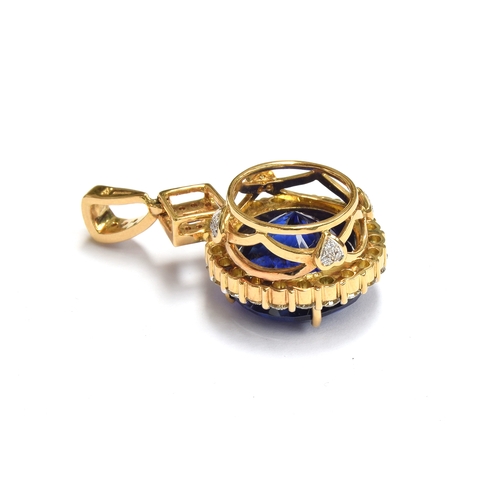 36 - An 18ct gold mounted large tanzanite pendant, the round brilliant cut stone measuring 16.5mmD and we... 