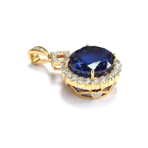 36 - An 18ct gold mounted large tanzanite pendant, the round brilliant cut stone measuring 16.5mmD and we... 