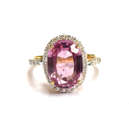 96 - An 18ct gold Pamir pink spinel and diamond cluster ring, the spinel measuring 13x9mm and weight 6.8c... 