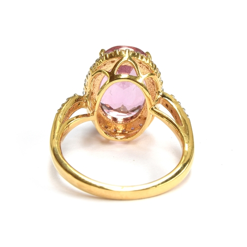 96 - An 18ct gold Pamir pink spinel and diamond cluster ring, the spinel measuring 13x9mm and weight 6.8c... 