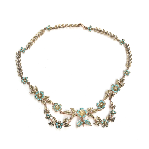 7 - An Edwardian silver gilt seed pearl and turquoise necklace, of floral swag form, 40cm unclasped leng... 