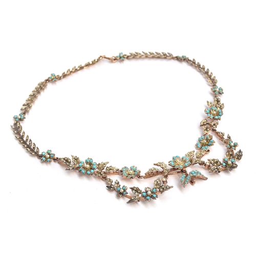 7 - An Edwardian silver gilt seed pearl and turquoise necklace, of floral swag form, 40cm unclasped leng... 