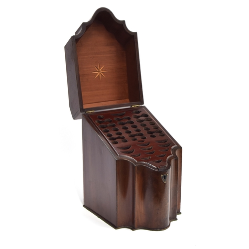 227 - A pair of George III mahogany serpentine knife boxes, the lids with star marquetry, opening to the o... 