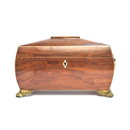 223 - A Regency mahogany and line inlaid sarcophagus tea caddy, tablet top, with twin brass handles, openi... 