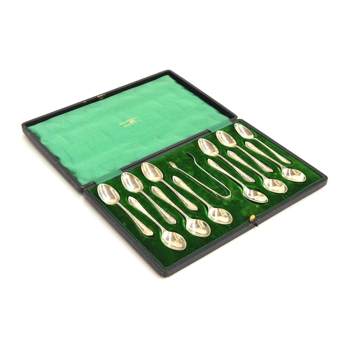 182 - A cased set of twelve teaspoons and a pair of sugar tongs by Walker & Hall, Sheffield 1912, 6.7ozt